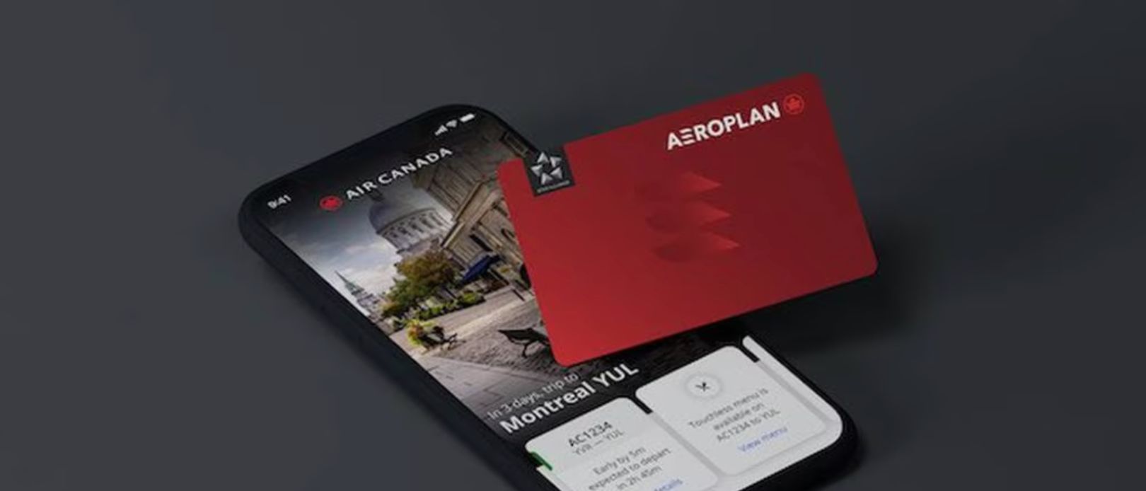 A smartphone showing the Aeroplan app with a credit card on top
